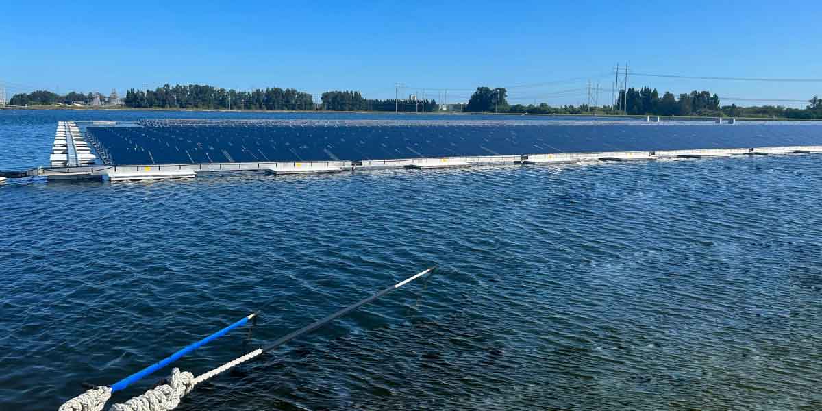 Floating solar farm secured using advanced mooring techniques, ensuring stability on water against wind and currents.