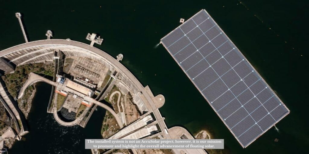 Aerial view of a dam and reservoir showing Floating Solar Farm Design Innovations with floating solar panels deployed on the water surface