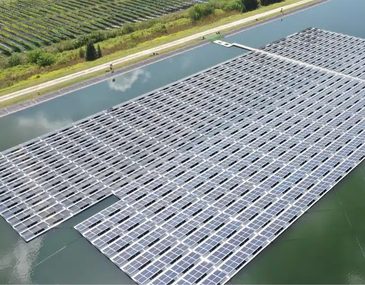 Floating solar panels on calm water, showcasing the innovative concept of floating solar farms