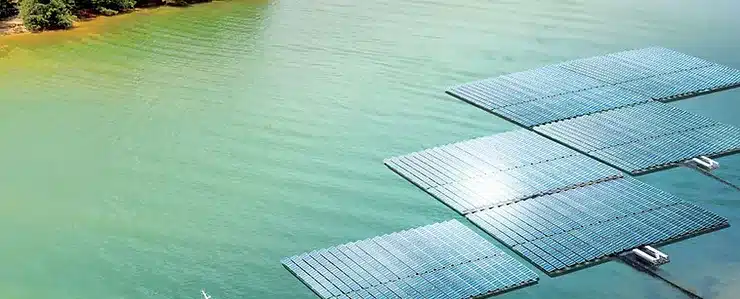 View of Innovative Solar Floatovoltaic Technology with solar panels floating on a scenic lake